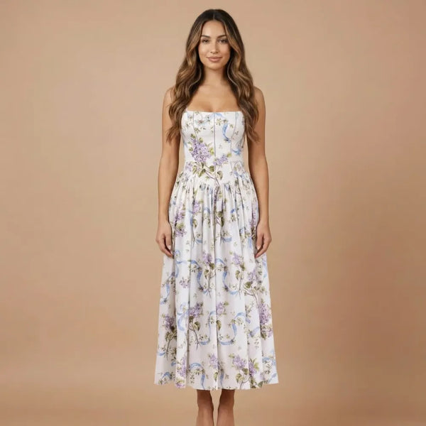 Front view of women floral strapless midi dress with white base and purple blue print