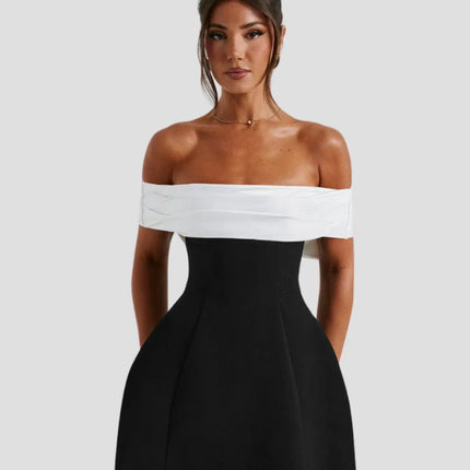 Women's off-shoulder black and white mini dress with wrapped neckline, front view