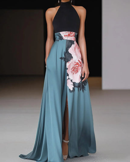 Halter maxi dress with black top, floral print waist band, and teal side slit skirt