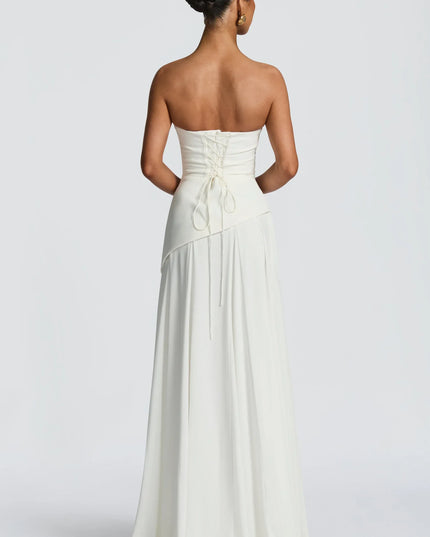 Ivory strapless cowl neck maxi dress with lace-up corset back and flowing hem