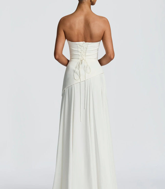 Ivory strapless cowl neck maxi dress with lace-up corset back and flowing hem