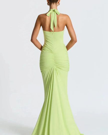 Back view of lime green halter maxi dress with tied neckline and ruched details