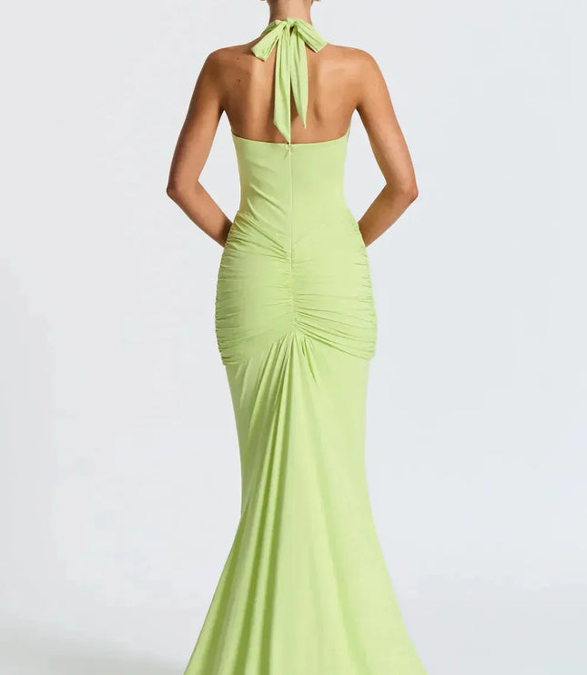 Back view of lime green halter maxi dress with tied neckline and ruched details