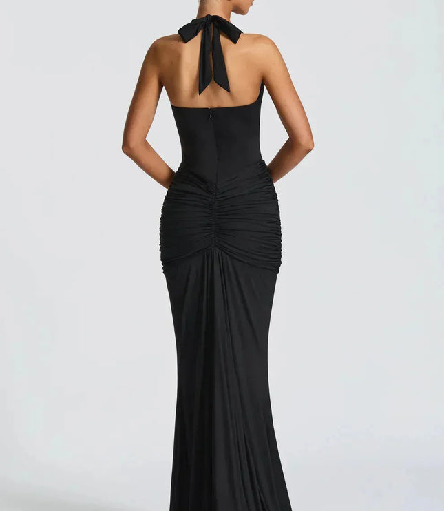 Back view of black halter maxi dress with tied neck detail