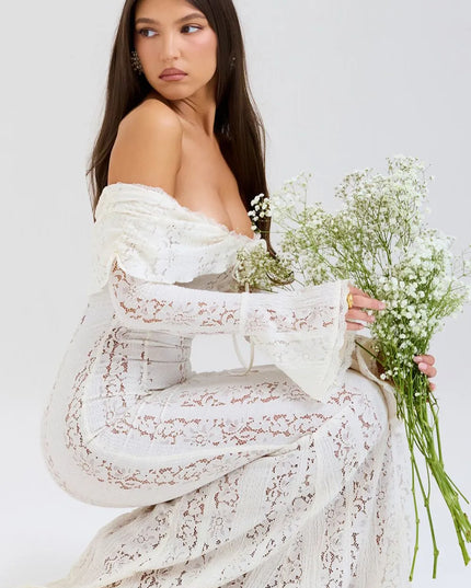 Cream off-shoulder lace maxi dress with long sleeves and flowing silhouette