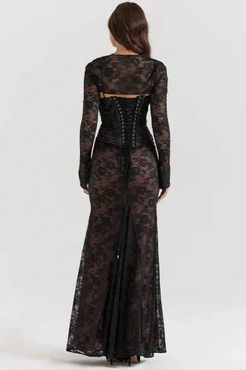 Rear detail of black lace maxi dress showing corset back and train