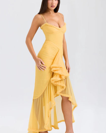 Side view of yellow maxi dress showing ruched bodice and ruffled trim