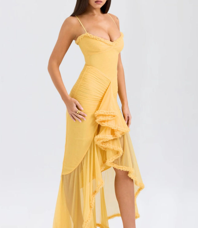 Side view of yellow maxi dress showing ruched bodice and ruffled trim