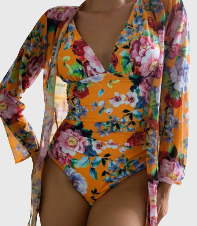 Orange floral one-piece swimsuit with long-sleeve wrap, vibrant botanical design
