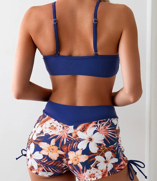 Navy blue high waist bikini top with tie front and floral print shorts back view