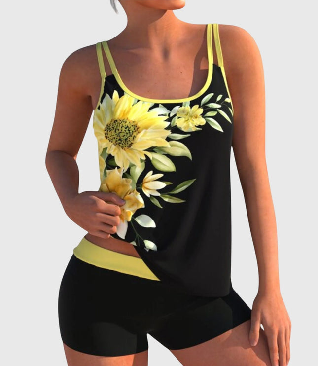Black tankini swimsuit with yellow sunflower and daisy print and yellow trim with matching shorts