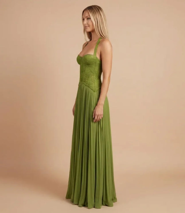 Side view of green sweetheart pleated maxi dress with straps and flowing skirt