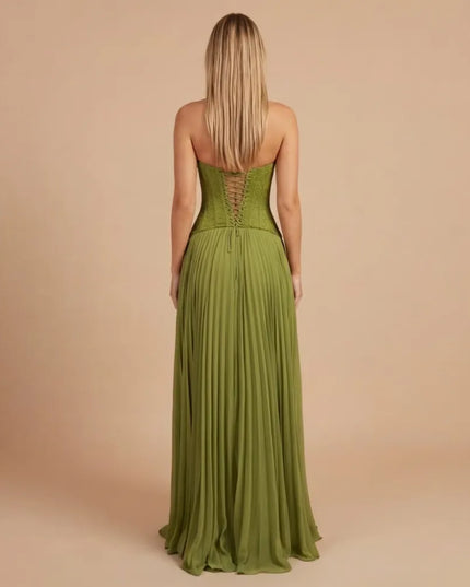Back view of green maxi formal dress with lace-up corset back and pleated skirt
