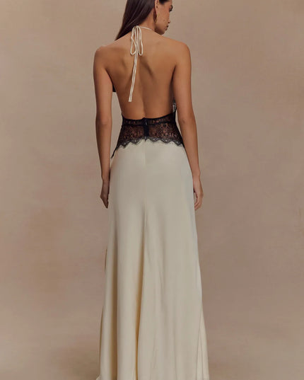 Back view ivory halter lace maxi dress with open back, tie neck straps, and black lace waist