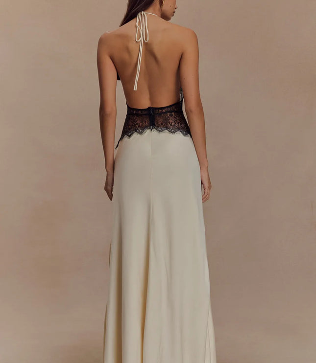 Back view ivory halter lace maxi dress with open back, tie neck straps, and black lace waist