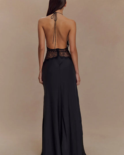 Back view black halter lace maxi dress with open back, tie neck, and lace waistband