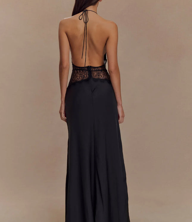 Back view black halter lace maxi dress with open back, tie neck, and lace waistband