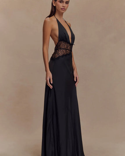 Angled side view black halter lace maxi dress with deep V neckline and sheer lace midsection