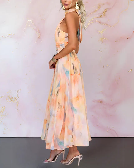 Side view of watercolor maxi dress showing open back and flowing skirt