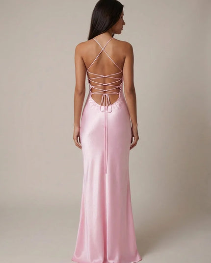 Back view of pink halter maxi dress with crisscross lace-up straps and open back detail