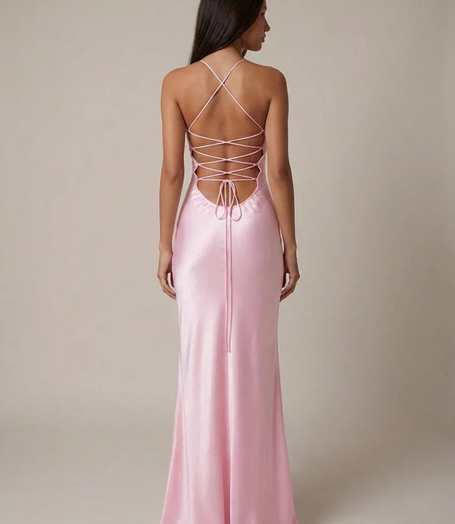 Back view of pink halter maxi dress with crisscross lace-up straps and open back detail