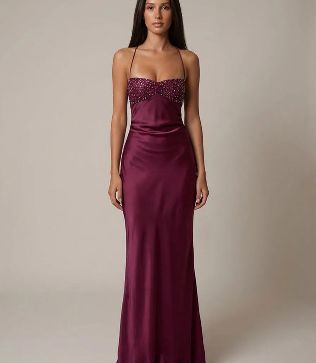 Close-up of pink beaded halter maxi dress bodice with ruched sweetheart neckline and pearl details