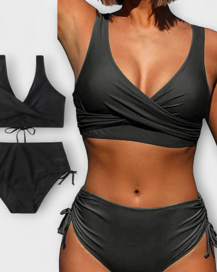 Black two-piece wrap bikini swimsuit with crossover top and tie-side bottoms
