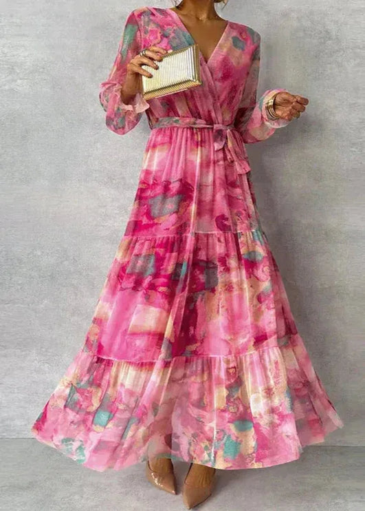 Pink floral maxi dress with v-neck and puffed sleeves, tiered skirt