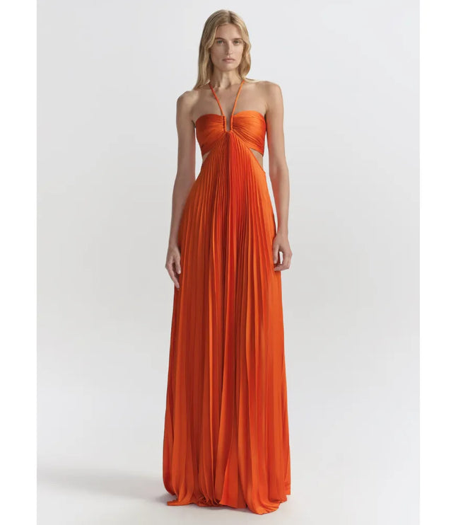 Orange halter maxi party dress with pleated skirt and cutout sides