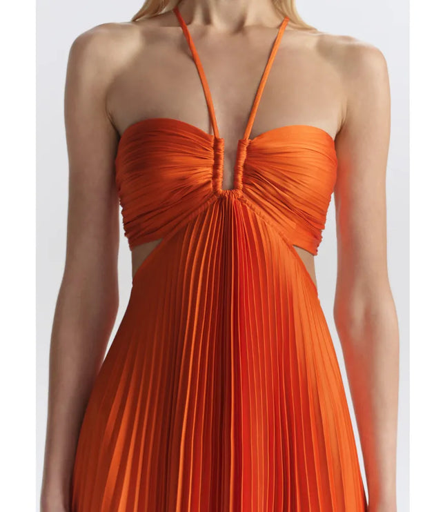 Close-up of orange halter maxi party dress showing ruched bust and side cutouts