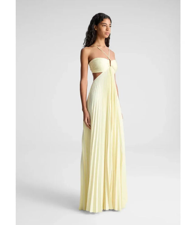 Pale yellow halter maxi party dress with pleated skirt and side cutout detail