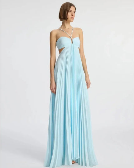 Front angled view of light blue halter maxi dress with ruched bodice and flowing pleats