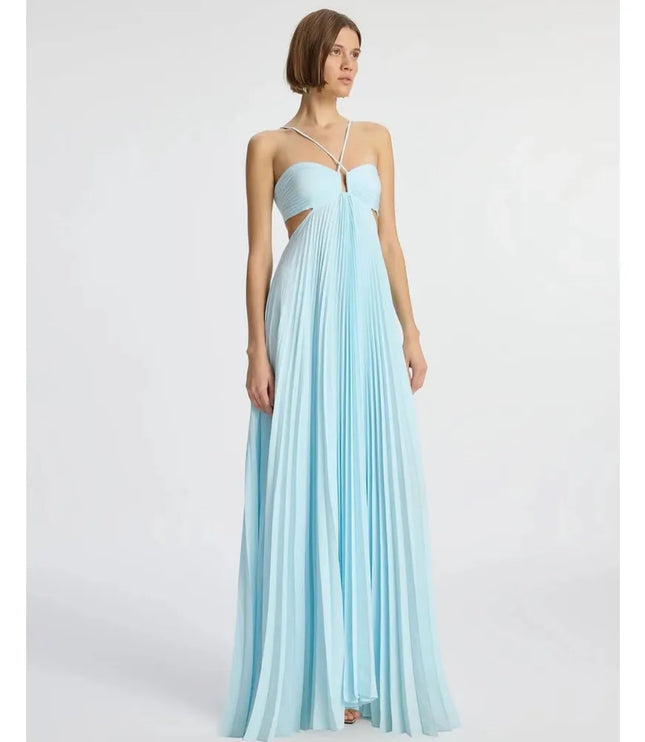 Front angled view of light blue halter maxi dress with ruched bodice and flowing pleats