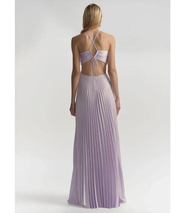 Back view of lavender halter maxi dress with open back and flowing pleated skirt