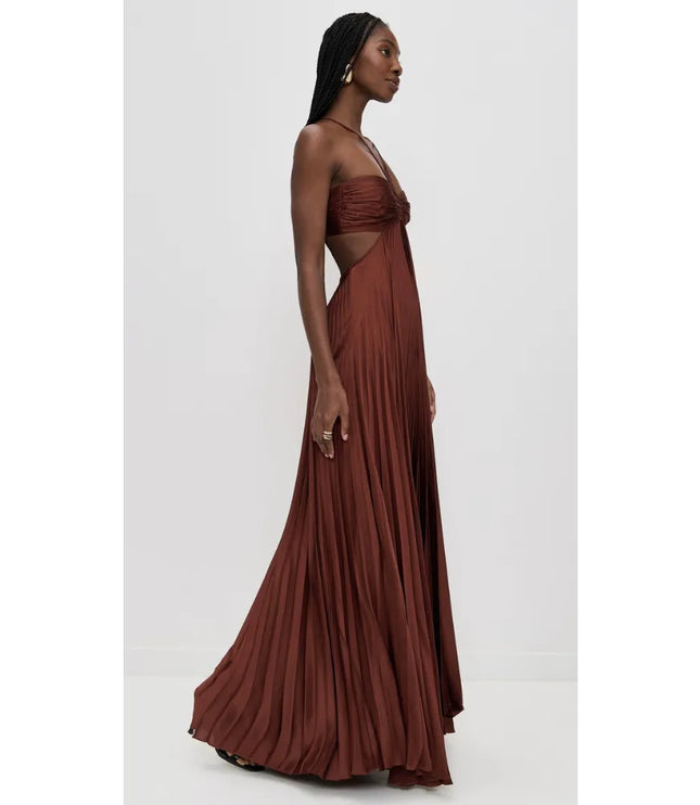 Side view of brown halter maxi party dress with open waist and flowing pleated skirt