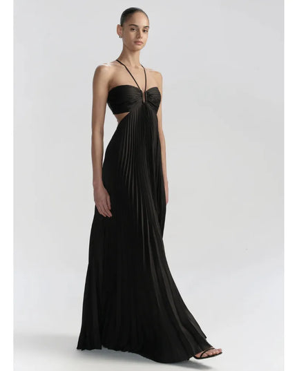 Front view of black maxi halter party dress with pleated skirt, side cutouts, and fitted bodice