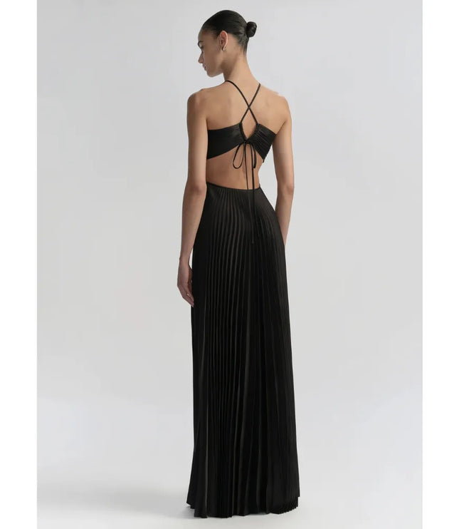 Back view of black maxi party dress with open back, crossed halter straps, and pleated fabric