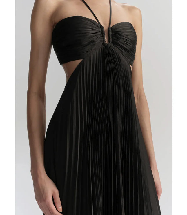 Close-up of black halter maxi dress showing ruched bust, center keyhole, and side cutout detail