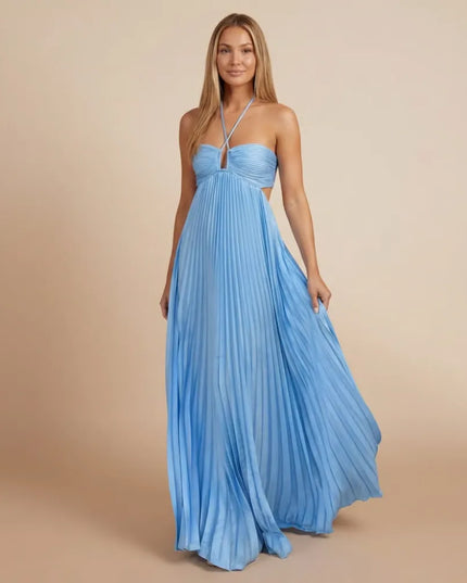 Front view of a light blue pleated halter maxi dress with crisscross straps and side cutout
