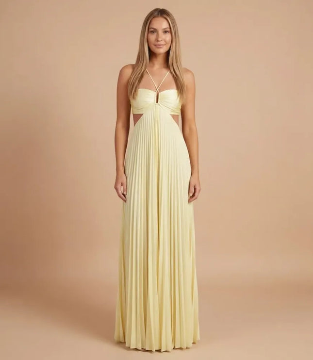Front view of pale yellow pleated halter maxi dress with cutout waist and crisscross straps