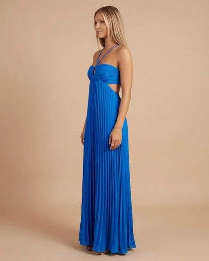 Side view of a bright blue pleated halter maxi dress showing the fitted bodice and open side detail