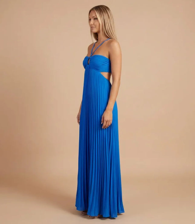 Side view of a bright blue pleated halter maxi dress showing the fitted bodice and open side detail