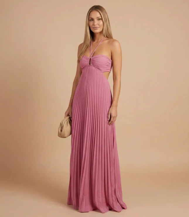 Front view of pink pleated halter maxi dress with ruched bust and side cutout