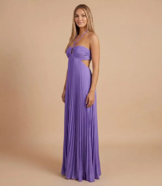 Front angled view of lavender pleated halter maxi dress with ruched bust and side cutout