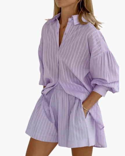 Lavender button-down collared mini dress with vertical pleats and puffed sleeves