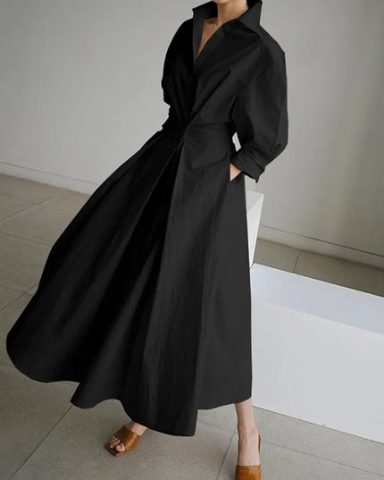 Black wrap midi dress with billowing puffed sleeves and flowing skirt