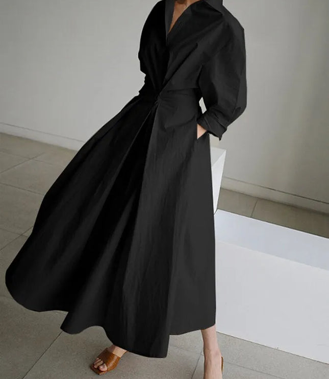 Black wrap midi dress with billowing puffed sleeves and flowing skirt