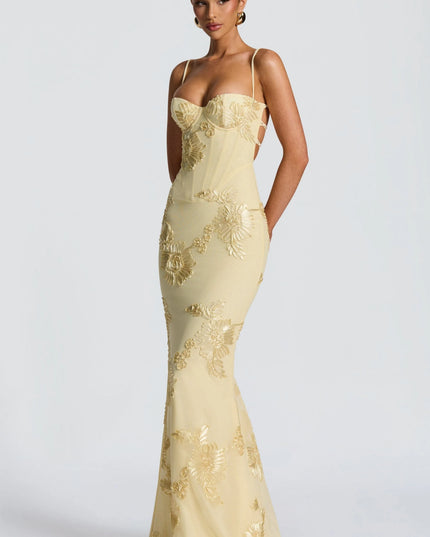 Cream maxi dress with gold floral appliqué and cutout side detail front