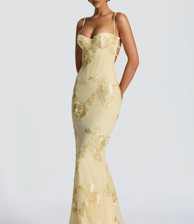 Cream maxi dress with gold floral appliqué and cutout side detail front