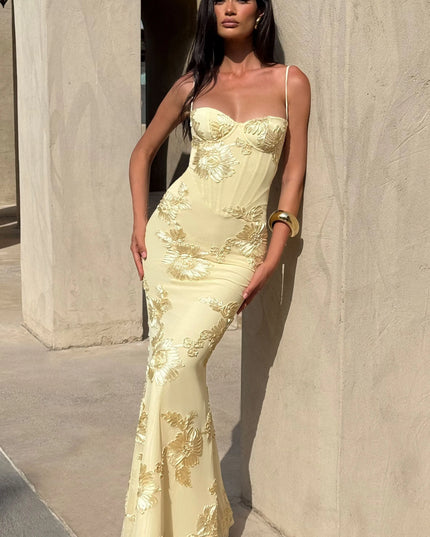 Cream maxi dress with gold floral embroidery and sweetheart bodice lifestyle